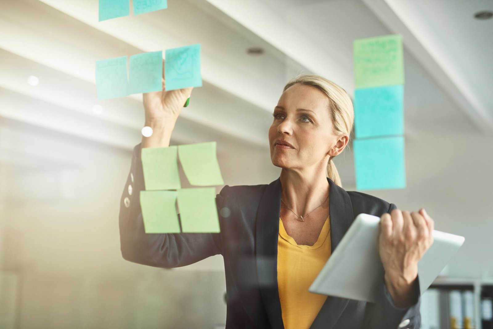 A solo business owner writing down her process while she works, an example of how to document business processes