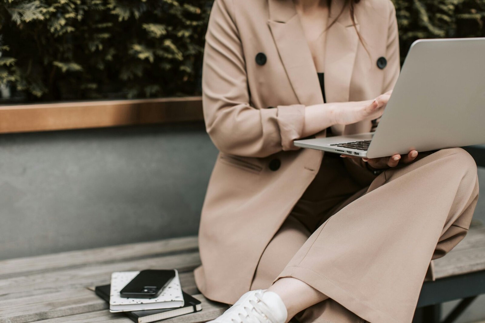 Woman reviewing revenue vs profit small business numbers at her desk